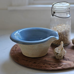 The Rustic Pour Bowl with Blue Glaze lends a vintage, old-world farmhouse look to any kitchen. It features a rustic hand-thrown pottery look with pour spout. The cottage blue glaze and unglazed bottom add to its rustic feel. 