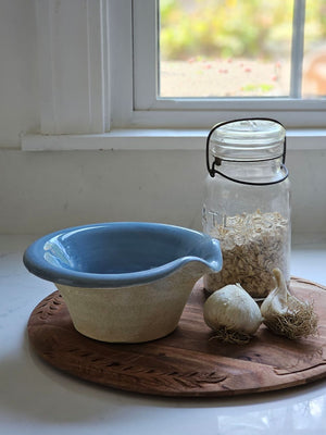 The Rustic Pour Bowl with Blue Glaze lends a vintage, old-world farmhouse look to any kitchen. It features a rustic hand-thrown pottery look with pour spout. The cottage blue glaze and unglazed bottom add to its rustic feel. 