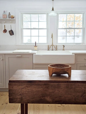 Add down-to-earth character to your farm table with our rustic Carved Wood Bowl with Legs. Inspired by the style of traditional hand-hewn dough bowls, this unique piece adds a touch of imperfection and charm. The decorative bowl is crafted from thick, carved wood and can be displayed year-round on a table, shelf, or counter. Each bowl is truly one-of-a-kind and complements any relaxed, rustic decor. Simply wipe clean with a dry cloth. Measures approximately 11.5” Diam x 4.75”H and varies in wood tone for a 