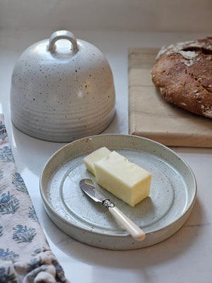 Keep butter close at hand with our Rustic French Butter Dish with Dome. Perfect style for old country kitchens, this generously sized ceramic dish can hold two sticks of butter. 6.75" Diam x 5.25"H