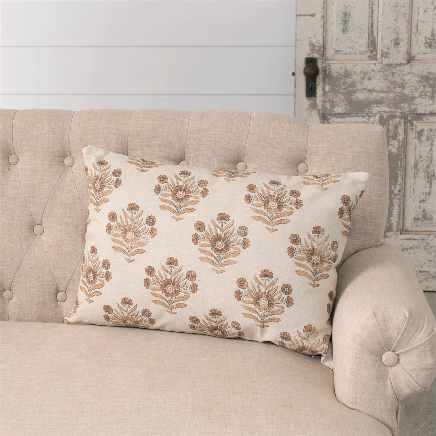 Add sweet, vintage cottage charm to any room with this Rustic Orange Block Print Pillow. Features faded browns and orange hues against a cream background. Crafted from 100% cotton. Includes a zippered closure for easy removal. Polyester insert included. 23"L x 16"