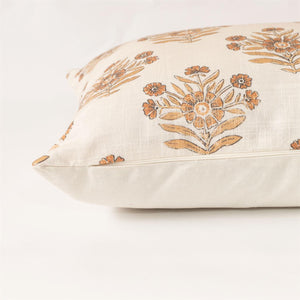 Add sweet, vintage cottage charm to any room with this Rustic Orange Block Print Pillow. Features faded browns and orange hues against a cream background. Crafted from 100% cotton. Includes a zippered closure for easy removal. Polyester insert included.