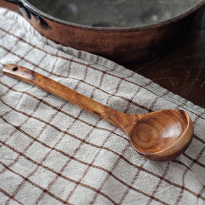 Crafted from natural wood, this ladle seamlessly blends functionality with understated elegance. Perfect for ladling soups, stews, and other dishes, it offers a lightweight yet durable construction that complements any culinary space. An environmentally conscious choice that marries rustic charm with enduring practicality. 12.4"H