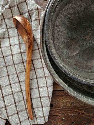 Crafted from natural wood, this ladle seamlessly blends functionality with understated elegance. Perfect for ladling soups, stews, and other dishes, it offers a lightweight yet durable construction that complements any culinary space. An environmentally conscious choice that marries rustic charm with enduring practicality. 12.4"H