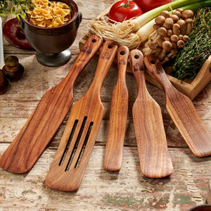 Our Rustic Wood Spurtle Spatula Set includes five durable teak wood utensils, designed for stirring, mixing, scraping, and serving. With their unique shape, these spurtles glide smoothly along cookware, making them ideal for everything from folding batter to sautéing. Lightweight yet sturdy, they offer a comfortable grip and are gentle on non-stick surfaces. A natural, eco-friendly alternative to plastic, this set brings both practicality and timeless style to any kitchen. Set of five.