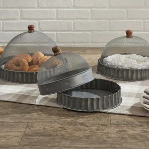 Keep bugs at bay on warm summer days with our Screen Food Covers with Metal Base, Set of Three . A wire mesh cloche, also known as a shoo-fly, is perfect for protecting food from flies and other insects.  Our set of three Wire Mesh Food Covers has tons of vintage charm and offers a range of sizes. They feature aged metal base with scalloped edges. Add rustic elegance to your farmhouse kitchen or patio with our vintage style Screen Food Covers, Set of Three. 8.75" DIA X 5.5"H 10.75" DIA X 8"H 12" DIA X 9"H