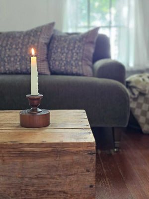 Bring a touch of timeless charm to your space with the Scribner Taper Candlestick Holder. Crafted from solid wood and finished in a rich, dark chestnut hue, this piece channels the cozy spirit of early American farmhouses. Its simple, sturdy design makes it perfect for brightening up your mantle, desktop, or dresser with a warm, rustic glow.