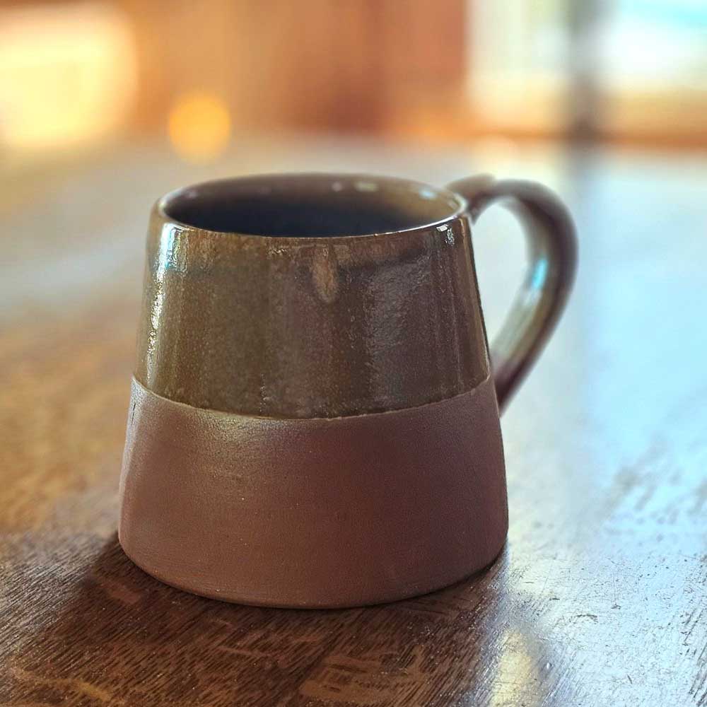 The Sedona Rustic Glazed Mug combines artisanal craftsmanship with natural beauty, showcasing a harmonious blend of terracotta clay and a uniquely imperfect glaze. Its earthy exterior and subtle moody blue interior evoke a refined yet grounded ambiance, making every coffee moment feel thoughtfully curated and effortlessly cozy.
