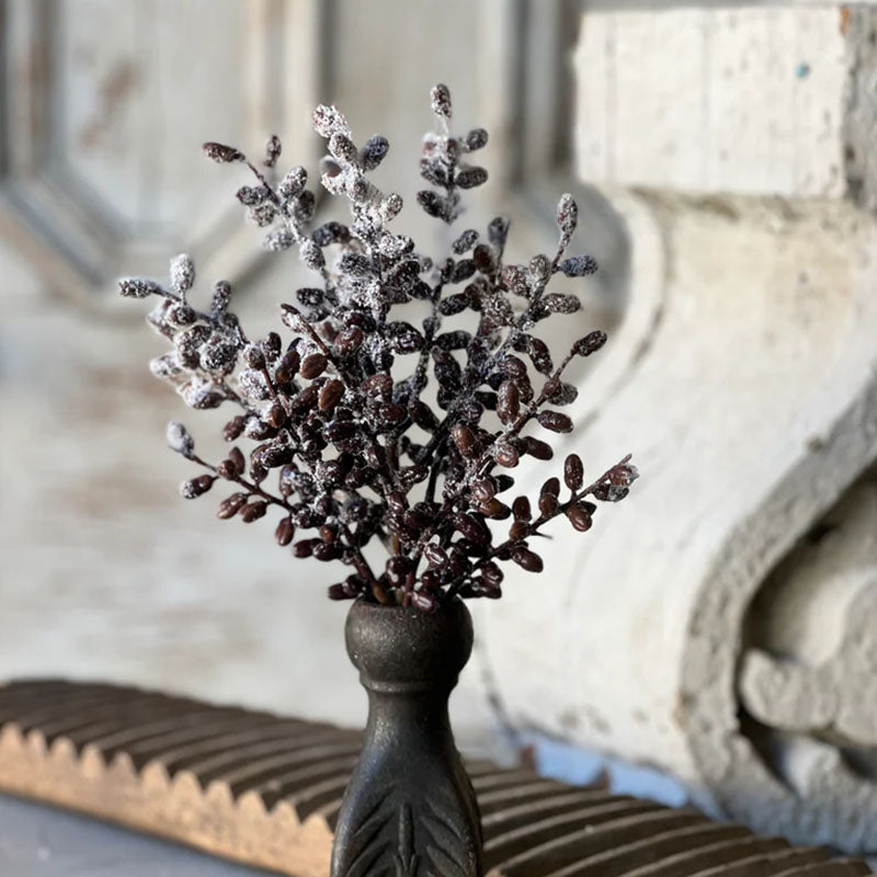 Evoke the serene beauty of a frost-kissed winter landscape with this artfully crafted faux botanical. Featuring delicate seed pods in rich, earthy tones adorned with a pristine coating of crystalline snow, this decorative Snowy Seed Pods Bush captures the quiet elegance of a dormant garden.