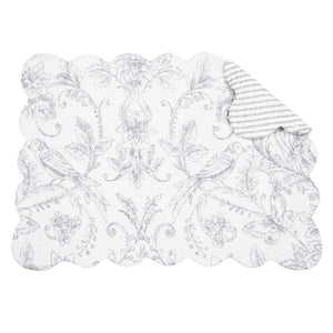 Our easy-care Songbirds Ticking and Toile Quilted Reversible Placemats combine light grey ticking and toile designs on a bright white background for relaxed, elegant style. Classic tailoring with scalloped edging, these placemats are perfect for dressing up your farmhouse table. Vintage style ticking stripes offer country charm, while the reverse side offers a faded botanical and bird toile style design. 100% cotton. Machine wash. Set of 2 Placemats