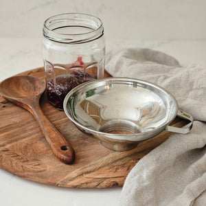 The Stainless Steel Mason Jar Funnel is designed to work with both Regular and Wide Mouth Mason jars, as well as other containers. The opening is slightly smaller than a Regular Mouth opening; it fits all Mason jars perfectly. This stainless steel is ideal for canning small batches of baby food, sauces, jams and purees. In addition to canning, it can be used to neatly portion batter into muffin tins or cake pans, or pair it with a strainer or cheesecloth for filtering homemade broths and juices 