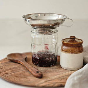 The Stainless Steel Mason Jar Funnel is designed to work with both Regular and Wide Mouth Mason jars, as well as other containers. The opening is slightly smaller than a Regular Mouth opening; it fits all Mason jars perfectly. This stainless steel is ideal for canning small batches of baby food, sauces, jams and purees. In addition to canning, it can be used to neatly portion batter into muffin tins or cake pans, or pair it with a strainer or cheesecloth for filtering homemade broths and juices 