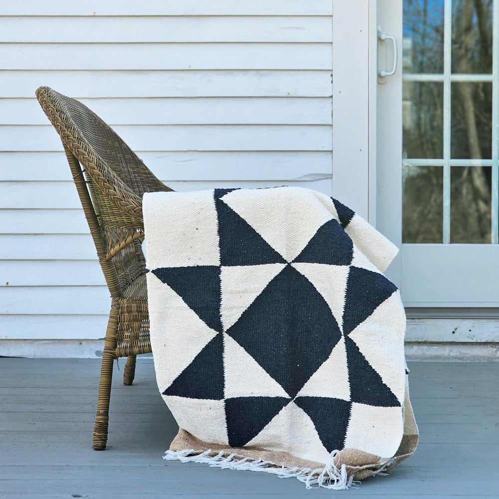 Add easy country charm with this Sawtooth Star Handwoven Throw. A fresh take on the iconic sawtooth star quilt block, this throw is both beautiful and sustainable. The bold navy blue stars and sand colored edge offers a classic farmhouse feel. 