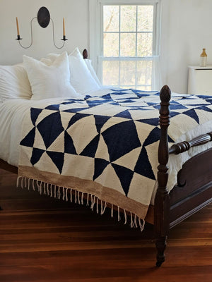 Add easy country charm with this Sawtooth Star Handwoven Throw. A fresh take on the iconic sawtooth star quilt block, this throw is both beautiful and sustainable. The bold navy blue stars and sand colored edge offers a classic farmhouse feel. 