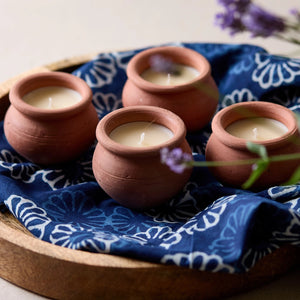 Add rustic ambiance with our Terracotta Candle Pots, Set of Four. Hand-crafted terracotta pots are filled with a blended beeswax and scented with lavender and a hint of vanilla. Set of four. Fair trade. Makes a great gift!