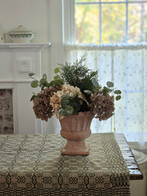 Winter Bouquet with Hydrangeas, Cedar and Eucalyptus in Terracotta Urn