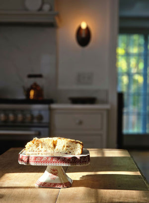 red transferware cake stand