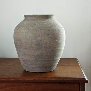 The Tuscan Stone Farmhouse Vase lends a rustic, old-world touch to any room or outdoor space. This sturdy ceramic vase has an aged terracotta patina, making this piece a perfect accent for those who love the perfectly imperfect look of vintage style home decor. Use to create stunning centerpiece displays with your favorite flowers or on its own to add texture and an earthy feel to your home decor.