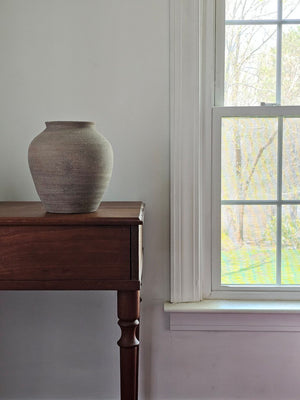 The Tuscan Stone Farmhouse Vase lends a rustic, old-world touch to any room or outdoor space. This sturdy ceramic vase has an aged terracotta patina, making this piece a perfect accent for those who love the perfectly imperfect look of vintage style home decor. Use to create stunning centerpiece displays with your favorite flowers or on its own to add texture and an earthy feel to your home decor.