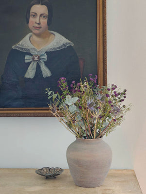 The Tuscan Stone Farmhouse Vase lends a rustic, old-world touch to any room or outdoor space. This sturdy ceramic vase has an aged terracotta patina, making this piece a perfect accent for those who love the perfectly imperfect look of vintage style home decor. Use to create stunning centerpiece displays with your favorite flowers or on its own to add texture and an earthy feel to your home decor.