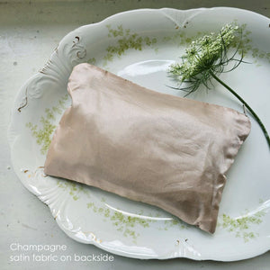 The Velvet Pouch with Vintage Floral Design is an elegant clutch perfect for makeup and other essentials. It showcases a romantic velvet floral pattern on one side, complemented by a smooth light beige-pink satin backside. Measuring 9" wide by 6" high, this zippered pouch combines style with practicality. Print will vary on each bag.