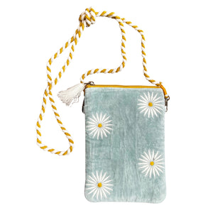 The Velvet Sling Bag with Daisies makes a pretty carry bag for your phone, glasses, keys and more. This stylish and functional zippered pouch features a dreamy light aqua velvet embroidered with a white daisy flower design. It also features a removable mustard yellow and white rope strap with clasp. 6"L x 10"H