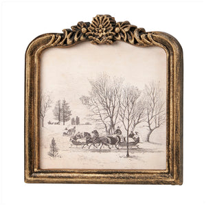 The Vintage Sleigh Ride Framed Wall Art adds a touch of old-world charm to any living space. The oval-top frame offers a unique touch. It features a molded ornate design with metallic antique golden wash over black for a antique look. This winter scene will bring a cozy, nostalgic feel into your home. Frame is plastic with no glass, making it light and easy to hang.