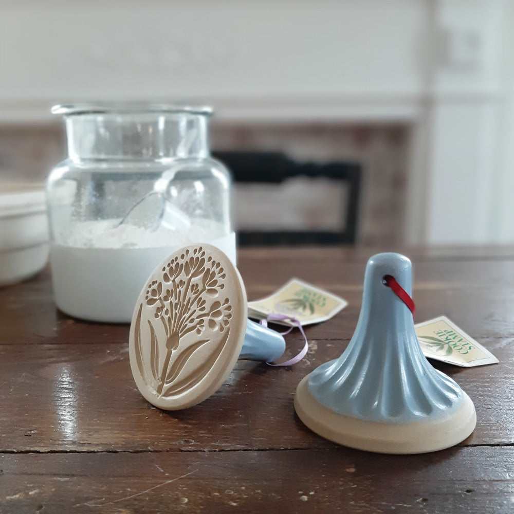 Create beautiful cookie designs with our Vintage Style Stoneware Cookie Stamps  Crafted in the USA, these natural stoneware cookie stamps lends a beautiful, old-fashioned touch to open shelves when not in use. Each features an embossed design with a vintage handle. 
