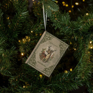 The Vintage Book Journal Ornament with Deer Cover is inspired by antique bookshop finds. This ornament is a hardcover journal with a faded cover featuring a deer with antlers and aged paper pages inside that can actually be used for note keeping. It's infused with vintage charm. Makes a sweet gift-topper.