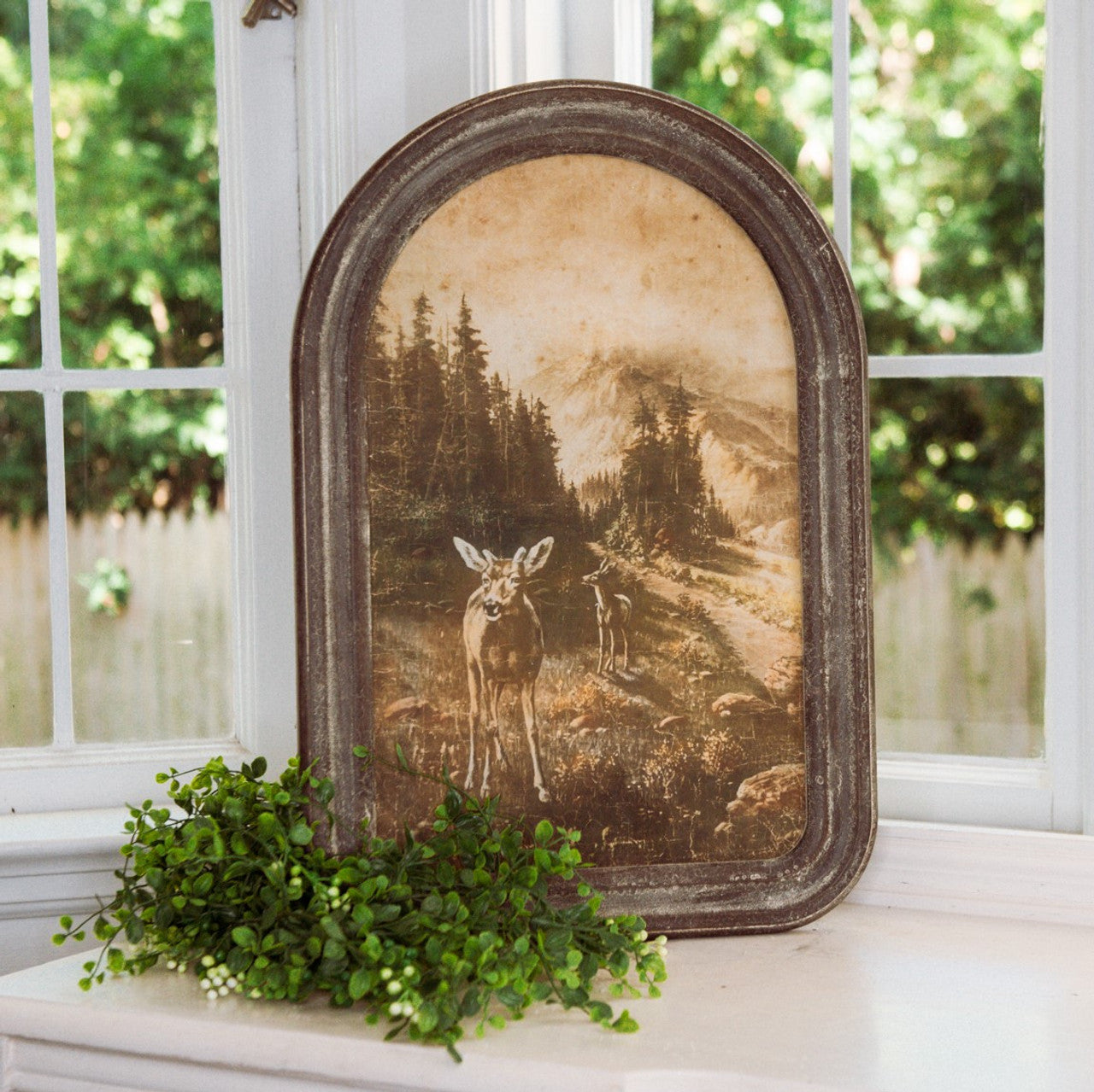 The Framed Vintage Deer Print adds a touch of woodland charm to any living space. The oval-top frame offers a unique touch, and its aged brown finish will bring a cozy, rustic atmosphere into your home. 15"L  x 1"W x  21.50"H  