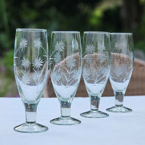 Inspired by antique shop finds, the Vintage Style Etched Flute Glasses, Set of Four brings timeless elegance to any occasion. The etched flower design lends a sophisticated vintage aesthetic that adds character and charm to any table setting. Ideal for farmhouse kitchens, cottage-style entertaining, or as a meaningful gift for those who appreciate quality glassware