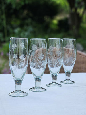 Inspired by antique shop finds, the Vintage Style Etched Flute Glasses, Set of Four brings timeless elegance to any occasion. The etched flower design lends a sophisticated vintage aesthetic that adds character and charm to any table setting. Ideal for farmhouse kitchens, cottage-style entertaining, or as a meaningful gift for those who appreciate quality glassware