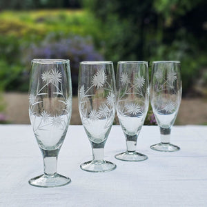 Inspired by antique shop finds, the Vintage Style Etched Flute Glasses, Set of Four brings timeless elegance to any occasion. The etched flower design lends a sophisticated vintage aesthetic that adds character and charm to any table setting. Ideal for farmhouse kitchens, cottage-style entertaining, or as a meaningful gift for those who appreciate quality glassware