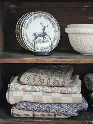 This stoneware Vintage Style Deer Plate features an elegant deer motif framed by delicate branch and acorn patterns, inspired by timeless old-world decor. Antique white with black details, it has a coordinating border design adds a refined touch, making it ideal for both everyday meals and special seasonal gatherings. Crafted for convenience, the plate is microwave, oven, dishwasher, and food safe, blending rustic charm with practical functionality. Includes one plate. 8" diam