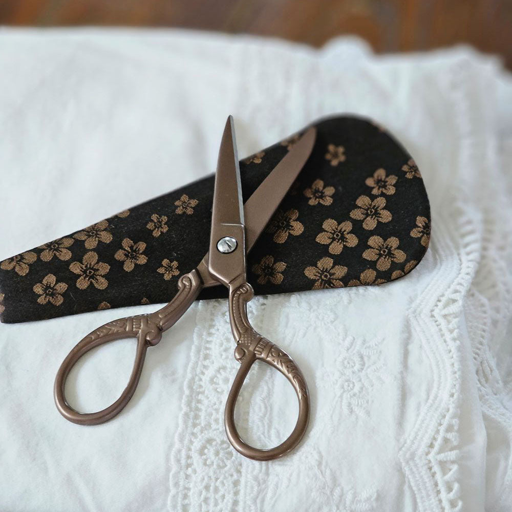 These exquisitely crafted Vintage Style Embroidery Scissors combine elegance and function, perfect for precise cutting in sewing, embroidery, and needlework. Each pair comes with a matching brocade sheath, ensuring safe storage and easy portability. A refined accessory for any craft enthusiast or a thoughtful collectible gift, these scissors bring timeless style to your creative projects.