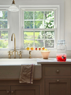 Add an old-timey touch to any occasion with our Vintage Style Glass Flip-Top Bail Wire Jar Drink Dispenser. Perfect for creating lemon infused sweet teas and lemonade, this flip-top jar is wide enough to easily add herbs and ice. The old-fashioned bail wire clamp and rubber ring keep things tightly sealed. 3.6L: 8.1" with spout x 5.8" Diam x 12.2"H