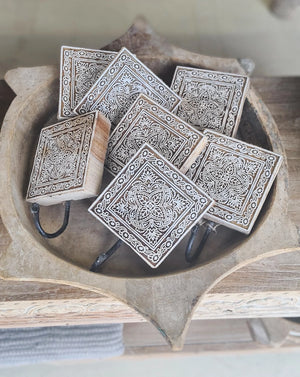 Embrace the charm of the old-world crafts with our Carved Wood Print Block Hook. This wall hook repurposes the intricately carved vintage printing blocks, traditionally used to create beautiful fabrics. Perfect for hanging jewelry, hats, towels, or utensils, this hook adds a touch of functional elegance to any space. Each hook tells its own unique story through imperfections that are celebrated as part of its history and character. Elevate your decor with these vintage-inspired pieces that seamlessly blend 
