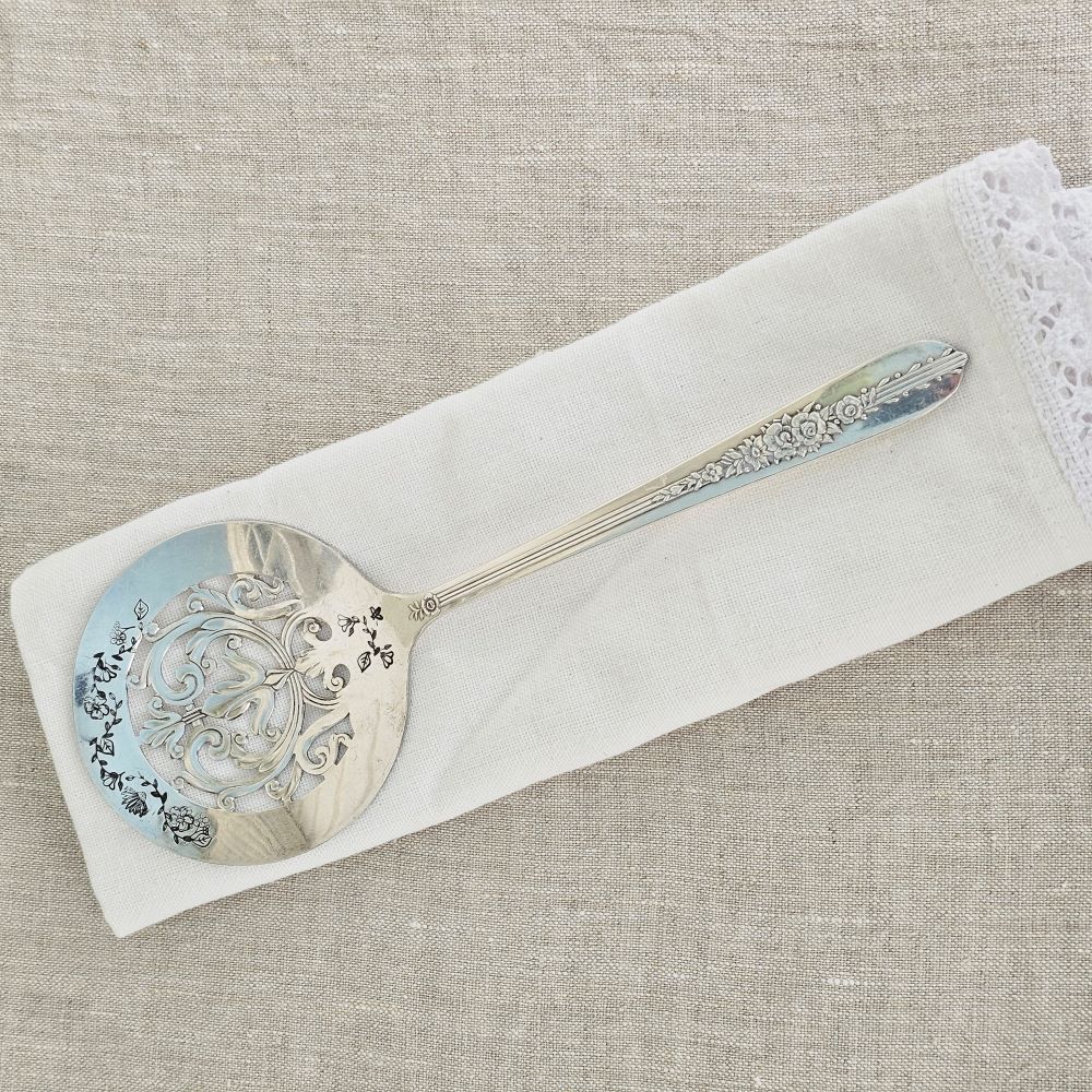 So sweet! So vintage! Darling Vintage Tomato Servers are hand-stamped with a floral design along the top and bottom of each server. Made from vintage silver plate servers, each item will be unique. Due to their vintage nature, flatware pieces may show signs of age and gentle use. No two are alike and the face and handle will vary.