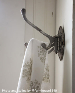 Our Warm Grey Swivel Wall Hook brings vintage style to any room. Perfect for hanging dishtowels, scarves, necklaces and more, this antique reproduction features three hooks that swivel and a total of four hooks. Add historic charm to your farmhouse entryway, kitchen or bath with this wall-mounted hook. Hardware not included.