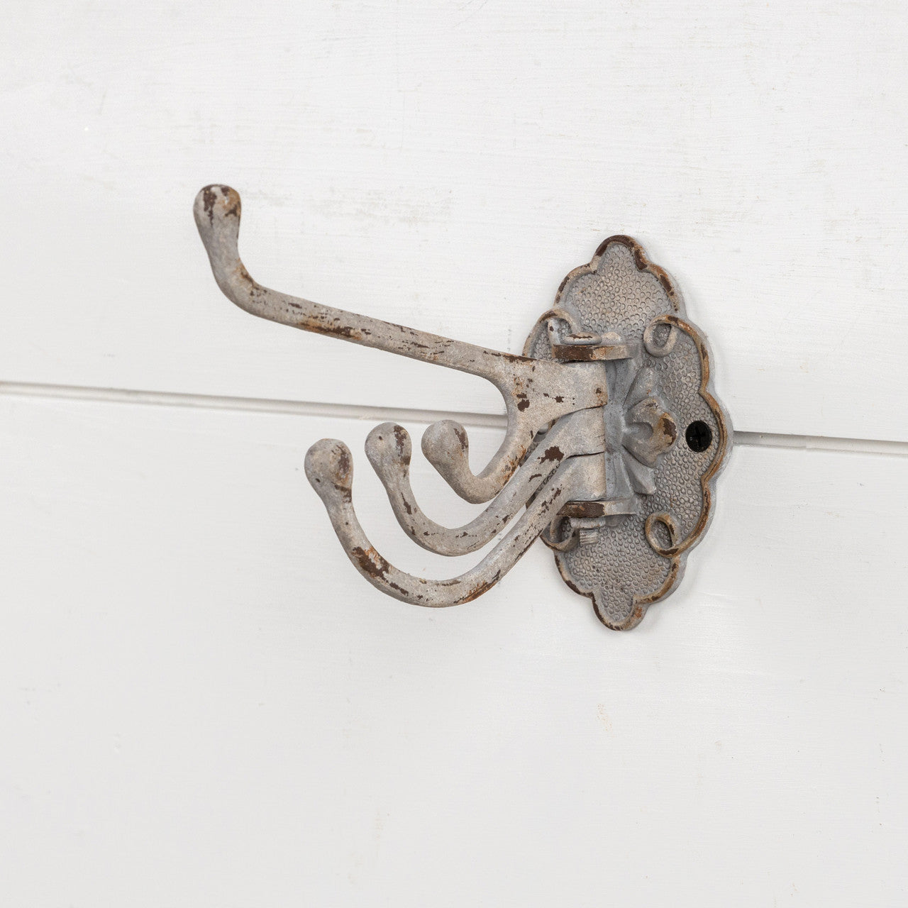 Our Warm Grey Swivel Wall Hook brings vintage style to any room. Perfect for hanging dishtowels, scarves, necklaces and more, this antique reproduction features three hooks that swivel. Add historic charm to your farmhouse entryway, kitchen or bath with this wall-mounted hook. 2.75"L x 5.25"Deep x 4.25"H