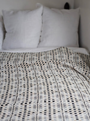 Add antique cottage charm with this Welsh Inspired Throw Blanket. Influenced by vintage Welsh tapestry patterns, this Welsh Inspired Throw Blanket adds instant warmth and character to any room. The throw features classic cream, Tan and Black geometric style pattern. It is made from premium cotton and is machine washable for simple upkeep. 52" x 74"