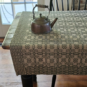Influenced by vintage Welsh tapestry patterns, the Welsh Inspired Table Square with Green and Flax Design adds instant old-world charm to any room. An ornate geometric pattern adorns the table square, along with a contrasting patterned border. Table squares are perfect for protecting wood tables or even larger tablecloths. They're great for adding a bit of warmth and character to smaller tables. 