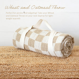 Whether it's on a bed or draped on a chair, you won't be able to resist this throw's amazing texture. The Wheat and Oatmeal Checkered Throw Blanket offers relaxed farmhouse elegance with its rustic gauze-like texture and earthy colors.&nbsp; The check pattern gives it instant country farmhouse style. It comes with a carry strap, so you can easily take it along to picnics and tailgating adventures. This throw has an environmentally-friendly twist, too! It's made with 50% recycled cotton and 50% recycled poly