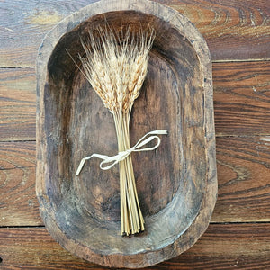 Celebrate the warmth of the harvest season with this Dried Wheat Bundle. Symbolic of a bountiful harvest, this heavy-headed wheat accent makes an elegant statement for any farm table or shelf. Bring nature's beauty to your country style decor with this small wheat bouquet. 5.5”L x 12”H