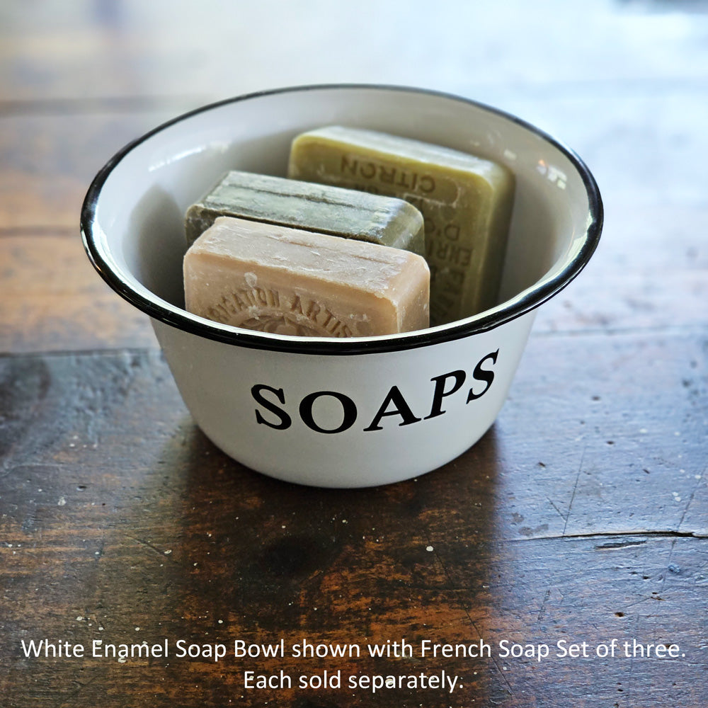 Our White Enamel Soap Bowl has a nostalgic quality that's perfect for a vintage style bathroom or guest room. The distressed white enamelware with black trim is classic farmhouse style. (Soaps and Brush Not Included.) 6" Diam x 3"H