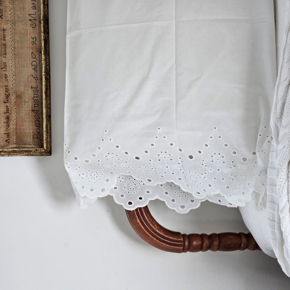 Our White Vintage Cotton Eyelet Lace Pillowcase brings shabby chic and farmhouse style together to create a dreamy white cottage bedroom. This ultra soft cotton pillowcase features scalloped edges with exquisite floral eyelet detailed trim. This lace edge pillowcase will add texture and a charming vintage look to your room.
