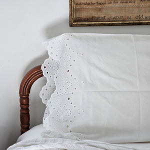 Our White Vintage Cotton Eyelet Lace Pillowcase brings shabby chic and farmhouse style together to create a dreamy white cottage bedroom. This ultra soft cotton pillowcase features scalloped edges with exquisite floral eyelet detailed trim. This lace edge pillowcase will add texture and a charming vintage look to your room.