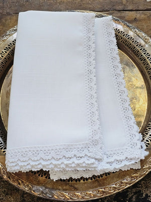 The White Lace Napkins are inspired by 19th century French linens. The edges are decorated with sweet lace trim. These napkins evoke a vintage charm and bring timeless French Country elegance to your farm table. Machine wash. 100% easy care Polyester. Set of Two. 20” x 20”