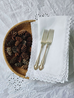 The White Lace Napkins are inspired by 19th century French linens. The edges are decorated with sweet lace trim. These napkins evoke a vintage charm and bring timeless French Country elegance to your farm table. 