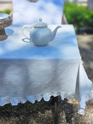 Add dreamy country charm to any occasion with our White Ruffle Prairie Tablecloth. Features a sweet ruffle trim and crisp white cotton. Inspired by vintage home linens, this cotton tablecloth gets prettier with every wash. Create instant cottage style or a dreamy farmhouse tables design for your next event